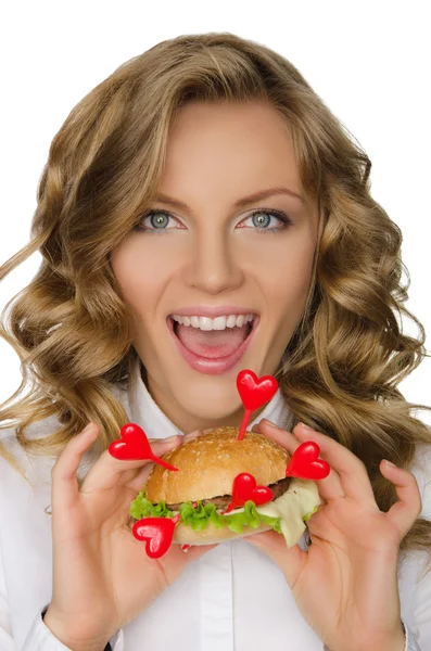 Mujer joven sonriente con hamburguesa de corazones —  Fotos de Stock