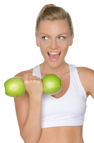 Femme avec des haltères de pommes vertes regardant loin — Photo