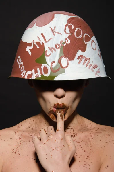 Sexy woman in chocolate camouflage sucks finger — Stock Photo, Image