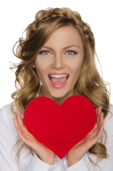 Beautiful blonde holding heart before him — Stock Photo, Image