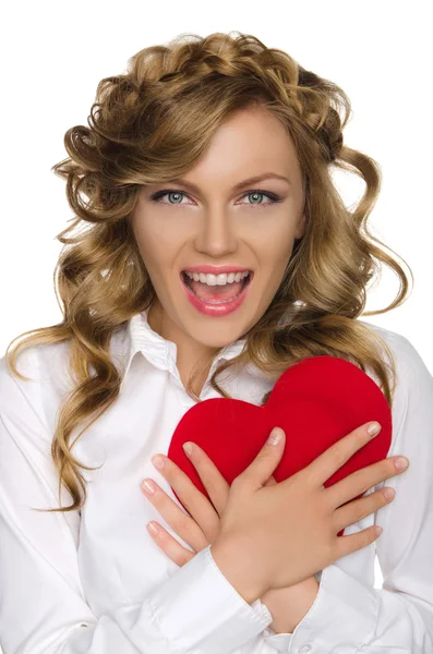 Beautiful woman pushes heart to himself — Stock Photo, Image