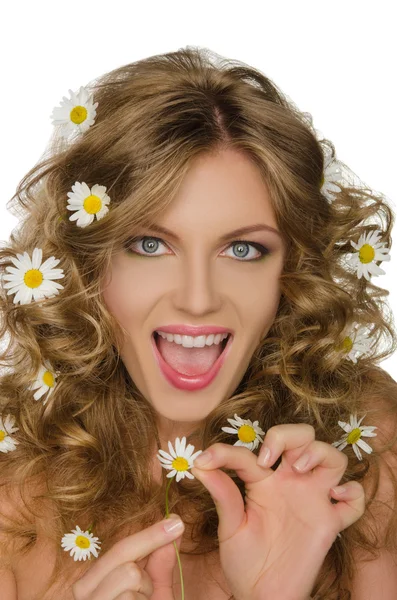 Beautiful woman with daisies in hair takes petals Royalty Free Stock Images