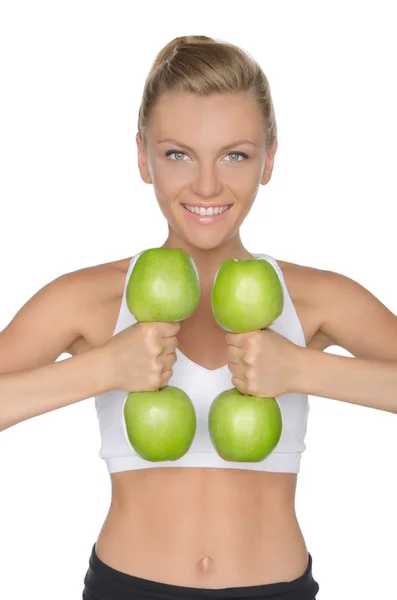 Young woman with dumbbells from ripe apples — Stock Photo, Image