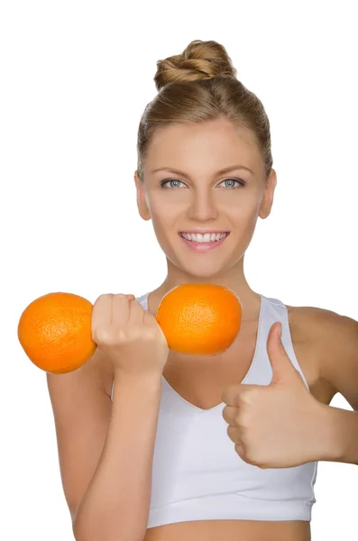 Mulher feliz com halteres frutas — Fotografia de Stock