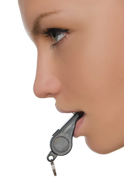Junge Frau mit Trillerpfeife im Mund — Stockfoto