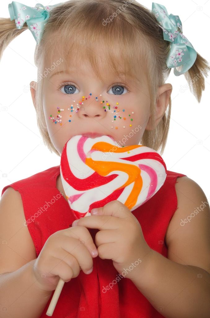 Little charming girl with colored Lollipop