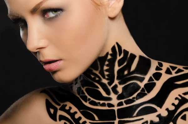 Portrait of attractive young woman, black body art — Stock Photo, Image