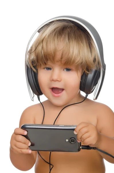 Happy child with headphones and smartphone — Stock Photo, Image