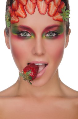 Beautiful woman, strawberries on face and teeth