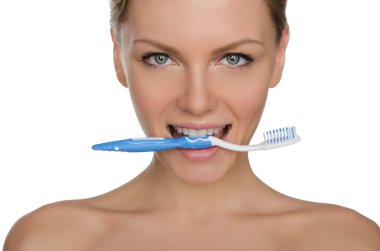 Portrait happy woman with toothbrush in teeth