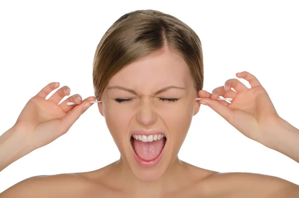 Wailing woman cleans ears with cotton sticks — Stock fotografie