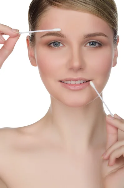 Woman holding cotton swabs in mouth and eyes — Stok fotoğraf