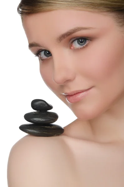 Pile stones on shoulder of charming woman — Stock Photo, Image