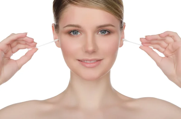 Beautiful woman cleans ears with cotton sticks — Stock Photo, Image