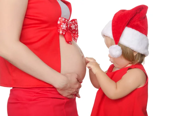 Barriga de criança e mulher grávida no Natal — Fotografia de Stock