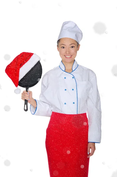 Asian chef with frying pan and Christmas hat — Stock Photo, Image