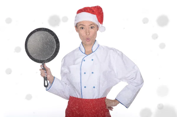 Überraschte asiatische Köchin mit Pfanne und Weihnachtsmütze — Stockfoto