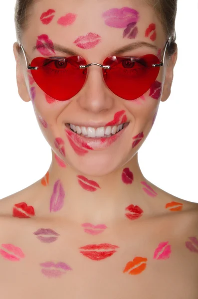 Young woman with kisses on her face and glasses, hearts — Stock Photo, Image