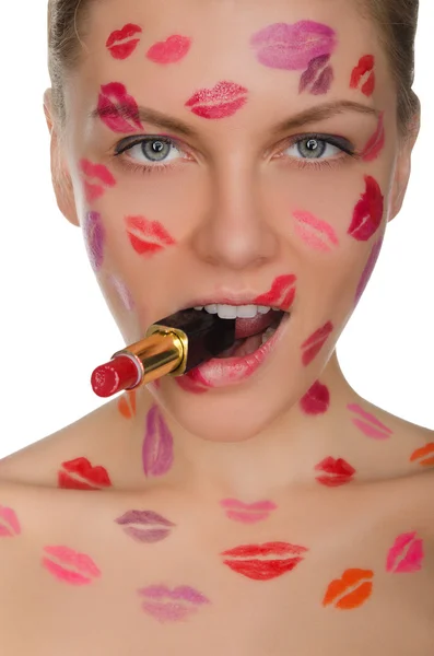 Schöne Frau mit Küssen im Gesicht und Lippenstift im Mund — Stockfoto