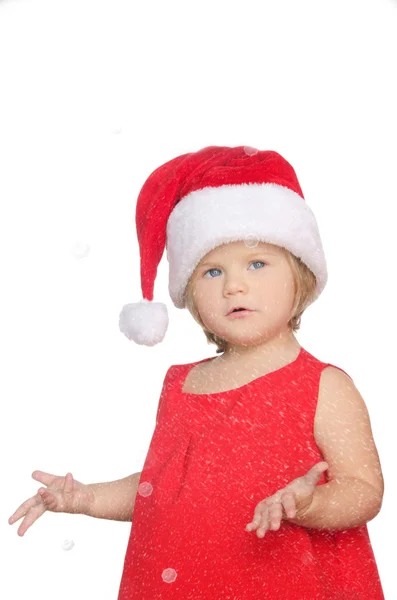 Surprised little girl in christmas cap, snow — Stock Photo, Image