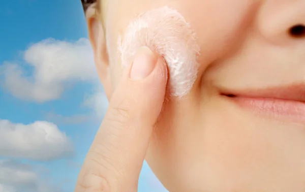 Fresh Clean Face Being Applied Moisturizer Cheek Cloud Background Symbolizing — Stock Photo, Image