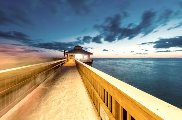 Beautiful pier at sunset — Stock Photo, Image