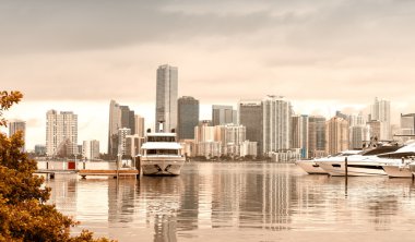 Miami skyline on a cloudy day from Rickenbacker Causeway   clipart