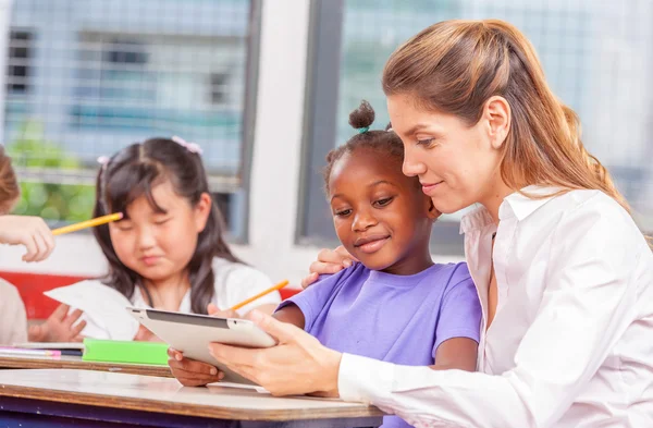 Beautiful teacher with mixed race classroom — Stock Photo, Image