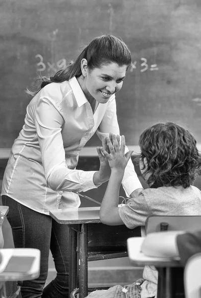 Beautiful teacher with mixed race classroom — Stock Photo, Image