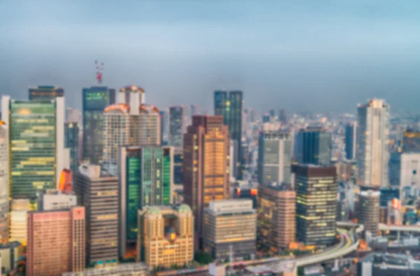 Tramonto aereo vista offuscata dello skyline di Osaka, Giappone — Foto Stock