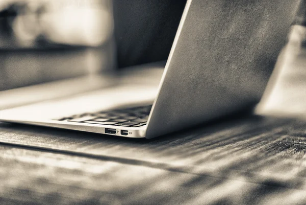 Modern laptop on wooden a table — Stock Photo, Image