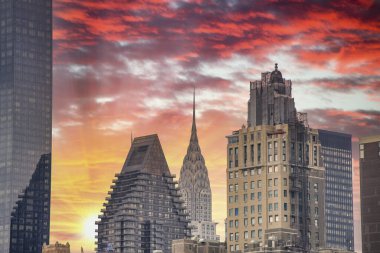 Sunset sky colors over Manhattan Skyline, New York City. clipart