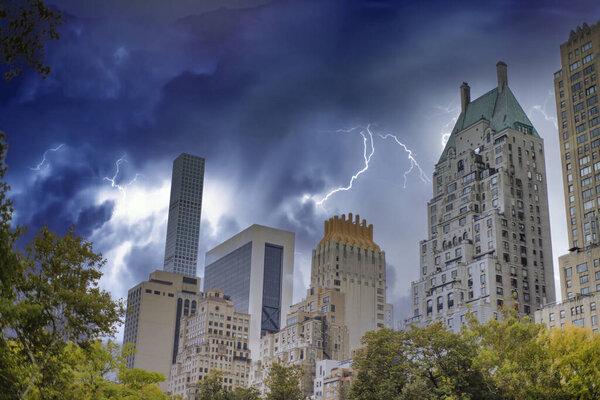 Midtown Manhattan skyscrapers under a coming storm, view form Central Park, New York, USA.