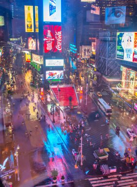 NEW YORK CITY - JUNE 11, 2013: Tourists crowded in Times Square, famous tourist attraction.