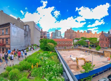 NEW YORK CITY - JUNE 8, 2013: Panoramic view of High Line crowded with tourists.