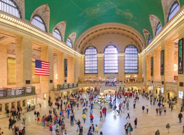 NEW YORK CITY - JUNE 10, 2013: Panoramic aerial view of Grand Central Main Concourse from the balcony.