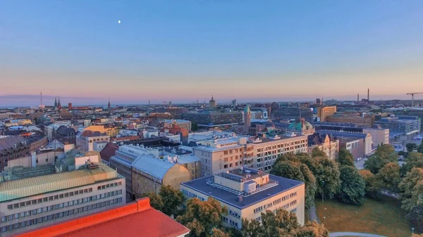 Aerial sunset view of Helsinki skyline from drone, Finland.