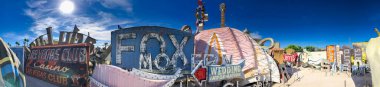 LAS VEGAS - JUNE 27, 2019: The Neon Museum, collection of neon old signs on a beautiful sunny day. Panoramic view.
