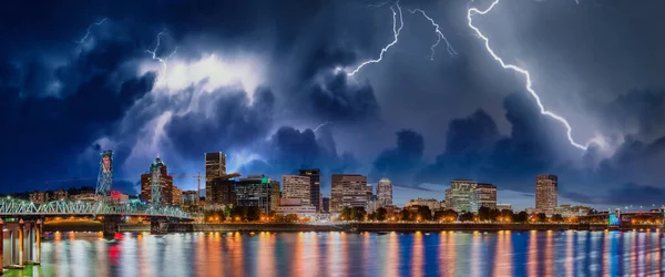 Storm approaching Portland, Oregon. City skyline with lightnings.