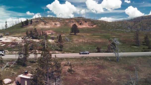 Hills and mountains of Yellowstone National park near the lake, aerial view — Stock Video