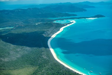 Aerial view of Whitsunday Islands National Park from the aircraft clipart