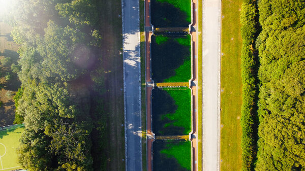 Reggia di Caserta, Italy. Aerial view of famous royal building gardens from a drone in summer season