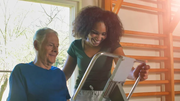 Rehabilitation Concept Elderly Retired Man Gym Supervised Expert African Female — Stock Photo, Image