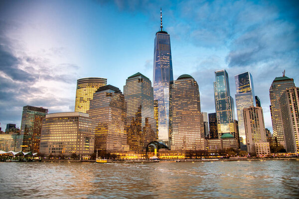 Downtown New York City at sunset from a moving ferry boat