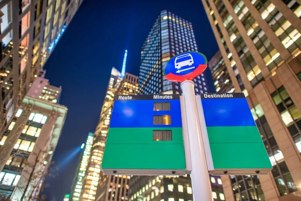 Empty treet signs and public transit directions at night, New York City. Transportation and holiday concept.