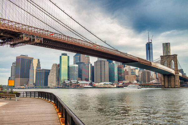 The Brooklyn Bridge and Pier 17 on a cloudy morning, New York City