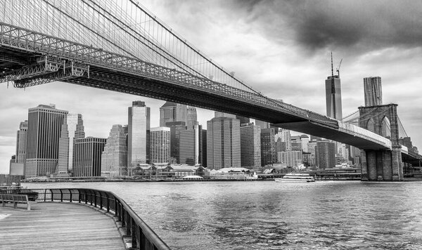 The Brooklyn Bridge and Pier 17 on a cloudy morning, New York City