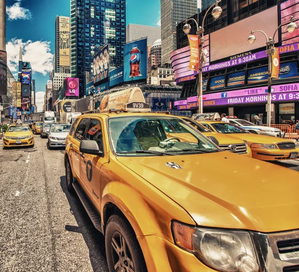 Yellow cabs in Times Square traffic — Stock Photo, Image