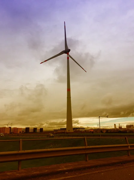 Industrial windmill outside city center — Stock Photo, Image