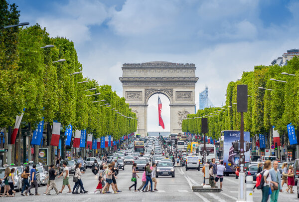 Tourists on the famous Champs Elysees Avenue